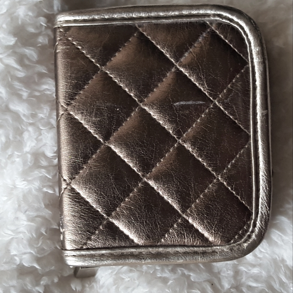 Zip wallet/change purse, metallic gold, two-sided with pink satin-like interior.
